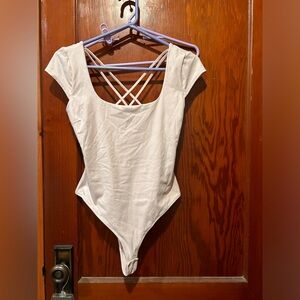 Garage light pink thong bodysuit